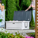 A man and woman standing next to a large CaterGator cooler.