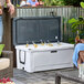 A large white CaterGator rotomolded outdoor cooler filled with ice and bottled drinks.