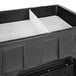 A black IRP Texas Icer Jr. ice bin with a white plastic shelf inside.