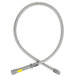 A flexible stainless steel hose with a yellow label and grey handle.