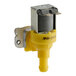 A yellow and silver Noble Warewashing solenoid valve.