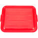 A red rectangular Vollrath Traex food storage box lid with white lines.
