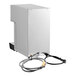 A stainless steel semi-automatic milk steamer and hot water dispenser with attached hoses and power cord.