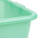 A green Vollrath Traex Color-Mate perforated drain box.