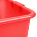 A close up of a red plastic container with perforations.