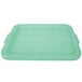 A Vollrath Traex Green plastic lid with a handle.