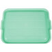 A green plastic Vollrath Traex Color-Mate food storage box lid with handles.