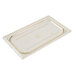 A clear plastic rectangular lid with a gold stripe on a counter.