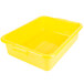 A yellow plastic Vollrath Color-Mate food storage container with a lid.
