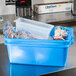 A blue Vollrath Traex food storage container with plastic containers and a lid inside.