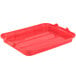 A red Vollrath Traex plastic lid on a food storage box.