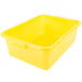 A Vollrath yellow plastic food storage container with a lid.