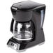 A black Proctor Silex programmable coffee maker with a glass pot.