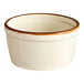 A white porcelain ramekin with a brown rim.