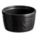 A black Acopa Keystone porcelain ramekin with a textured surface.