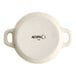 An 8 oz. vanilla bean porcelain mini casserole dish with handles, shown from the bottom with the Acopa brand mark.