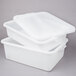 Three white Vollrath Traex plastic containers with recessed lids stacked together.
