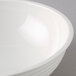 A close up of a white Cambro Camwear round ribbed bowl.