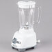 A white Proctor Silex blender with a clear glass container.