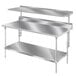 A silver Advance Tabco splash mount stainless steel shelf above a metal work table.