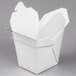 A white Fold-Pak Chinese take-out box with a wire handle.