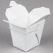 A white Fold-Pak Chinese take-out container with a wire handle.
