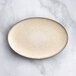 An Acopa Cape oval gray porcelain platter with a speckled design.