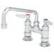 A T&S chrome deck-mount faucet with two blue handles.