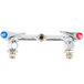 A silver T&S wall mounted pantry faucet base with red and blue CC connections.