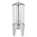 A Vollrath stainless steel beverage dispenser with brass accents.