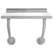 A stainless steel wall mounted table with metal pipes.