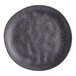 A dark gray round melamine plate with a speckled pattern.