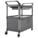A gray Rubbermaid instrument cart with sliding drawers.