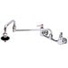 A chrome T&S pot filler faucet with double-jointed swing spout and lever handles.