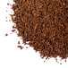 A pile of Ellis Mezzaroma Costa Rican Tarrazu coffee powder on a white background.