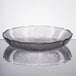 An Arcoroc glass bowl with a pattern on it.