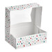 A rectangular bakery box with a clear window and a modern Christmas print featuring trees, snowflakes, and candy canes.