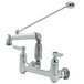 A silver T&S wall mount mop sink faucet with a long handle.