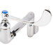 A T&S polished chrome wall mount service sink faucet with blue wrist action handles.