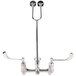A T&S polished chrome wall mount service sink faucet with two wrist action handles.