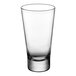 A clear, tapered 15.25 oz. beverage glass with a thick base.