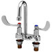 A chrome T&S deck mount metering faucet with 2 wrist action handles and a rigid gooseneck spout.