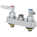 A T&S chrome deck mount faucet base with two handles and valves on a white background.