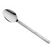 A stainless steel dessert spoon with a textured handle.