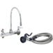 A T&S deck-mount workboard faucet with gooseneck spout and hose.
