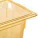 A close up of a Vollrath 1/4 size amber high heat plastic food pan.