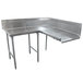 A stainless steel corner dishtable with two legs.