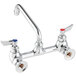 A chrome wall-mount faucet with an 8-inch swing spout, two lever handles marked for hot and cold, and 8-inch centers.