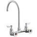 A wall-mount faucet with an 8-inch gooseneck spout, 8-inch centers, and lever handles for hot and cold water.