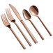 A five-piece set of rose gold stainless steel flatware including two forks, a knife, and two spoons.